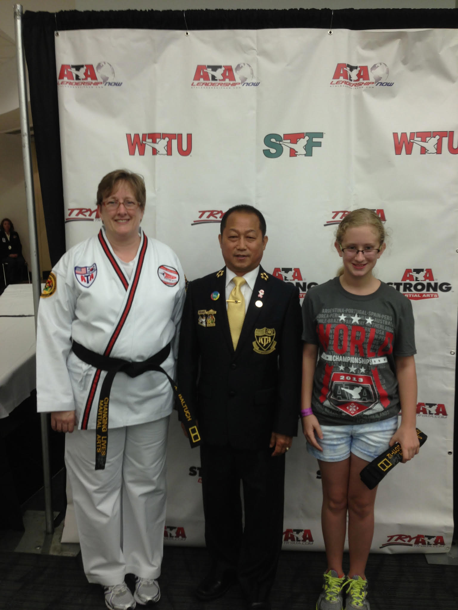 Sarah and her mother at a Taekwondo tournament